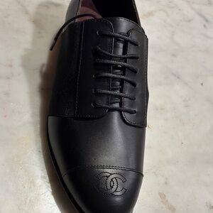 CHANEL Black Leather Lace-Up Loafers with Embossed CC